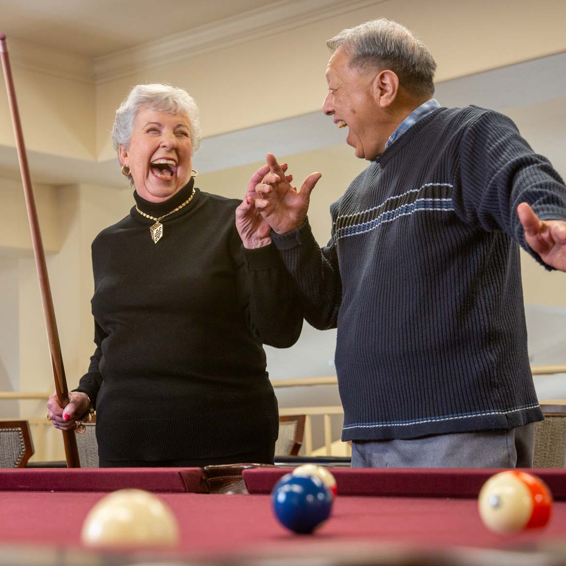 Residents playing billiards at Steeplechase